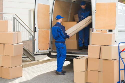 Removal team loading household items for a UK moving service