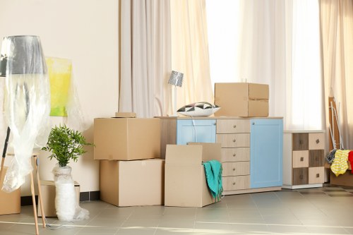 Removal team handling furniture safely during a house move
