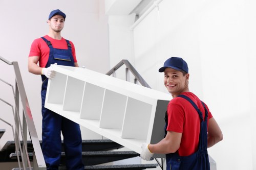 Careful loading of business furniture during a commercial move in Sunbury