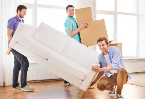 Local removal team loading furniture for a Sunbury house move