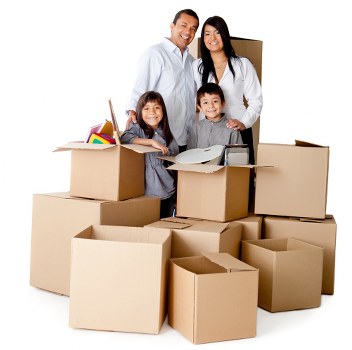 Packed moving boxes and wrapped furniture ready for transport